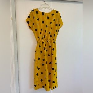 Vintage yellow dress with black polka dots.